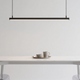 Modern pendant light above a dining table showcasing elegant dining room chandeliers 2025.