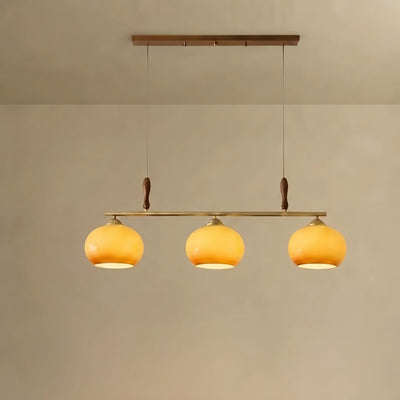 Modern Pendant Lamp — Amber Glass Shades & Brass Bar Wood Accent for Dining