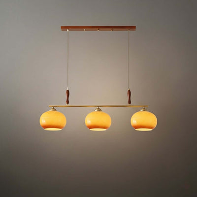Modern Pendant Lamp — Amber Glass Shades & Brass Bar Wood Accent